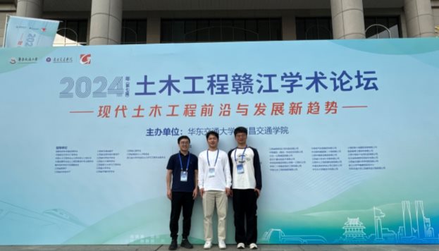 A group of men standing in front of a large sign&#xA;&#xA;Description automatically generated
